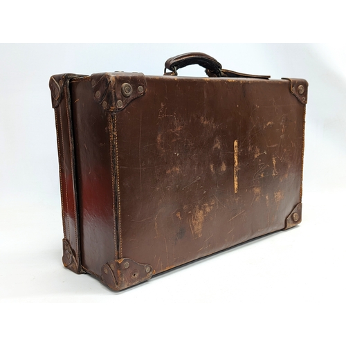 155 - An early 20th century leather case. 58x36x18cm