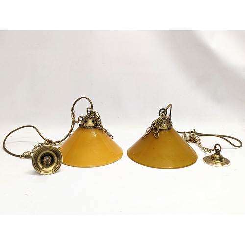 160 - A pair of vintage glass ceiling lights with amber glass shades. 23.5cm