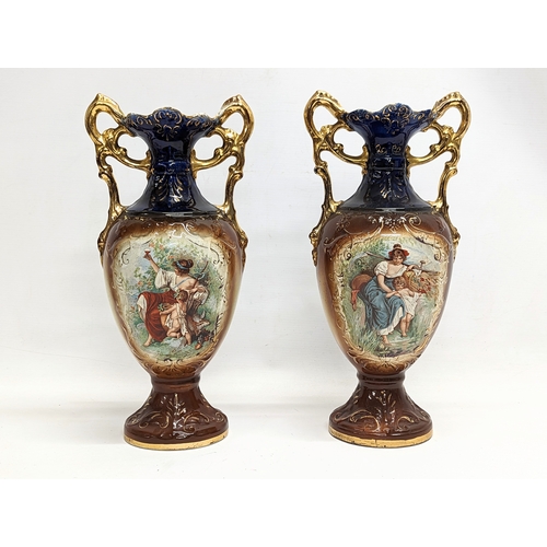 409 - A pair of early 20th century A G Harley Jones pottery vases. 38cm