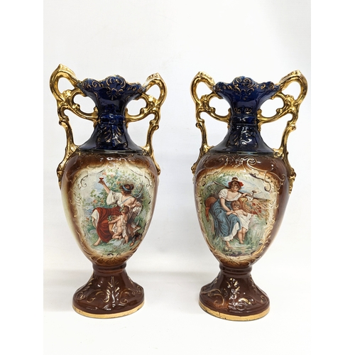 409 - A pair of early 20th century A G Harley Jones pottery vases. 38cm