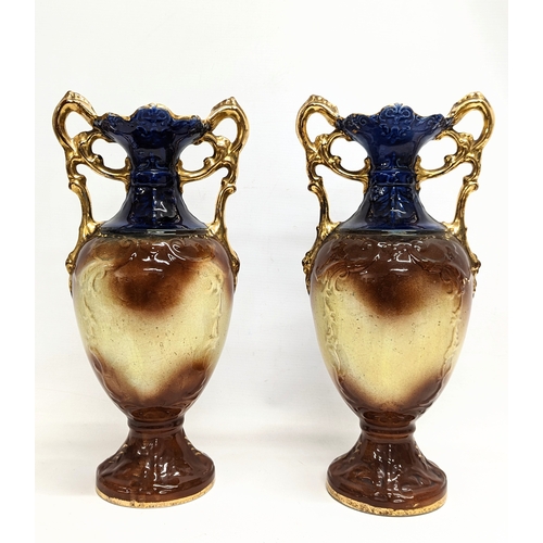 409 - A pair of early 20th century A G Harley Jones pottery vases. 38cm