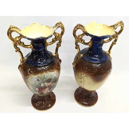 409 - A pair of early 20th century A G Harley Jones pottery vases. 38cm