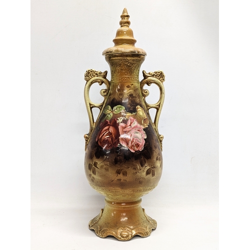 410 - An early 20th century A G Harley Jones pottery vase with lid. 50.5cm