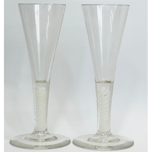 428 - A pair of 18th century George III glass twist stem champagne flute glasses. Circa 1760. 17.5cm