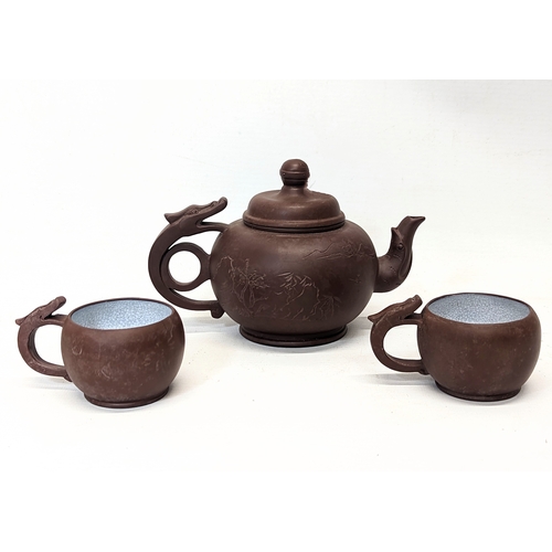 429 - A 3 piece Yixing Chinese pottery tea set. Teapot measures 16x11cm