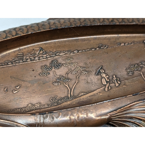 439 - A late 19th/ early 20th century ornate Japanese sushi plate, oxidised copper over Pewter. 40cm