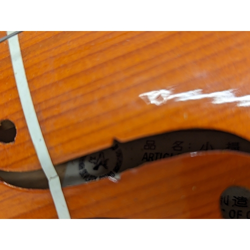 219 - A vintage Skylark miniature violin in original case, made in The People's Republic of China. 43cm