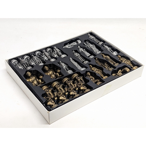 328 - A complete The Lord of The Rings, The Fellowship of The Ring pewter and bronze effect chess set.