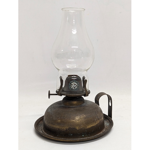 382 - A Victorian brass finger lamp. 23.5cm