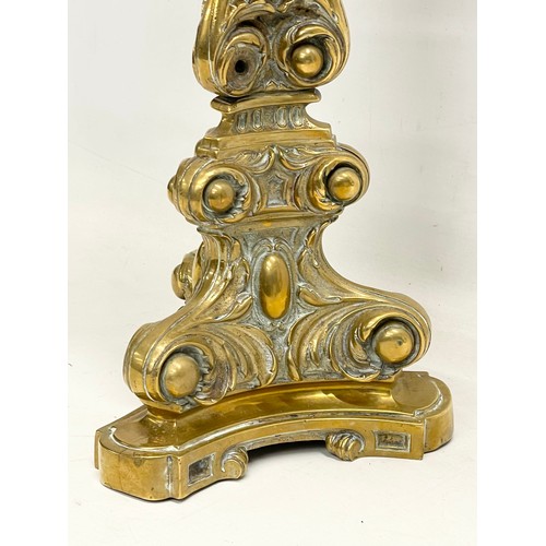 131 - A tall Victorian ornate brass oil lamp. 77cm