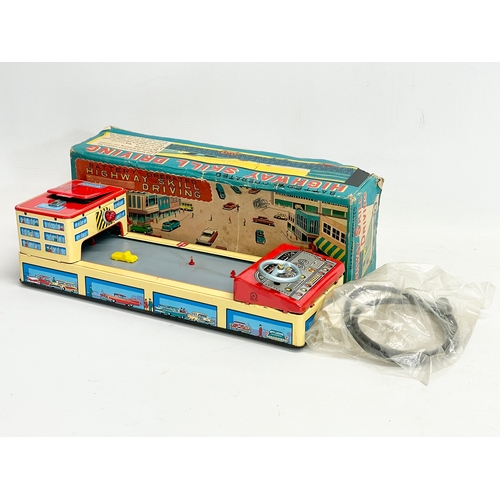 72 - A vintage tin plate Highway Skill Driving in original box. Made in Japan. Box measures 34cm