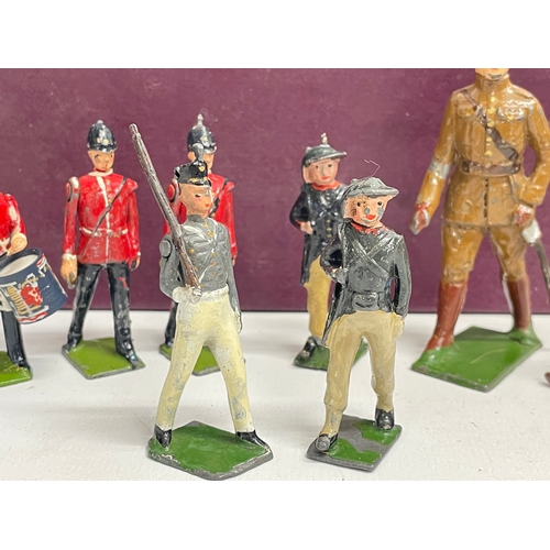 96 - A good collection of late 19th/early 20th century led model soldiers, by Britains, John Hill & Co et... 