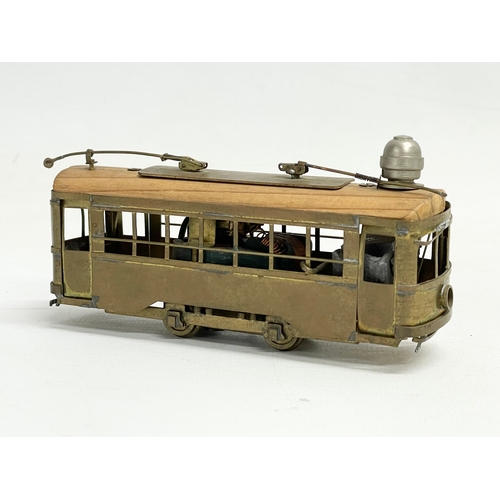 102 - A vintage brass mechanical model tram