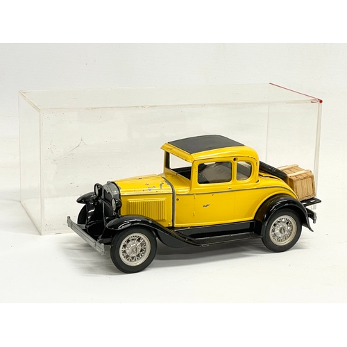 106 - A Hubley Toys die cast model Ford in a Perspex box. Car measures 20cm