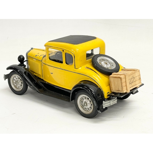 106 - A Hubley Toys die cast model Ford in a Perspex box. Car measures 20cm