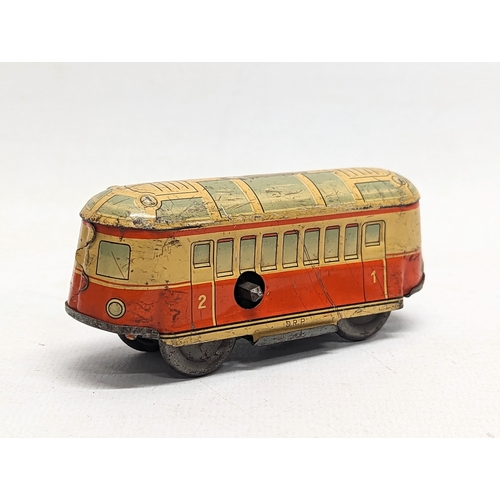 114 - A vintage wind up tin toy, made in 