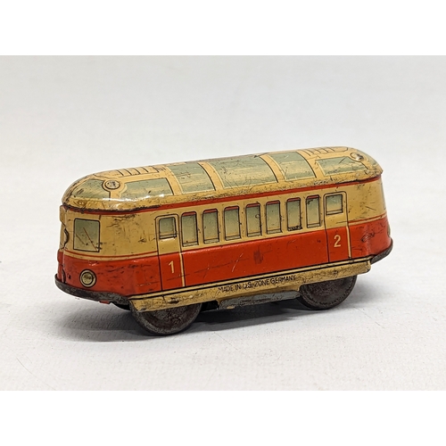 114 - A vintage wind up tin toy, made in 