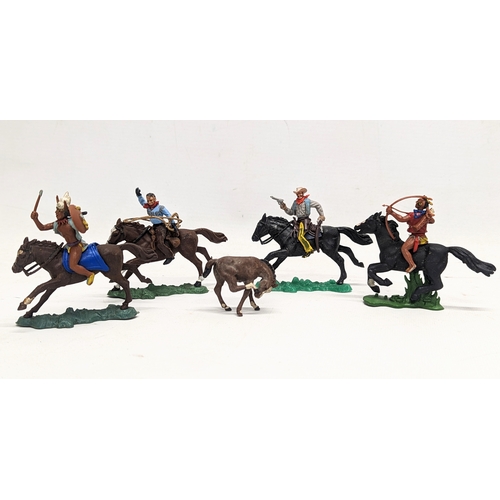 117 - 4 vintage model cowboys and Native Americas by Britains, 