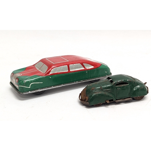 118 - A vintage Glam Toy Products tin toy car, made in England, with other vintage tin toy car. Largest me... 