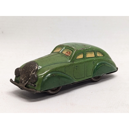 119 - A vintage wind-up tin toy car, made in D. R. P. 11cm