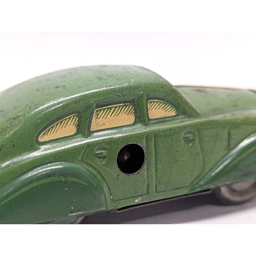 119 - A vintage wind-up tin toy car, made in D. R. P. 11cm