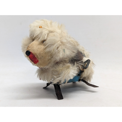 121 - A vintage wind-up toy, made in Japan. 12cm