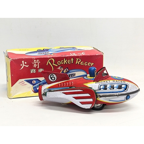 123 - A vintage tin toy Rocket Racer, made in China. Box measures 21cm