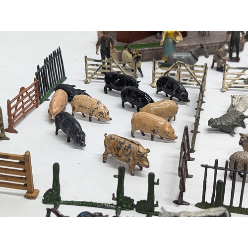 127 - A large collection of vintage Britains led animals, etc. Including Blacksmiths, Racehorses, farm yar... 