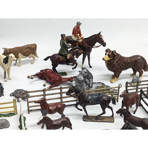 127 - A large collection of vintage Britains led animals, etc. Including Blacksmiths, Racehorses, farm yar... 