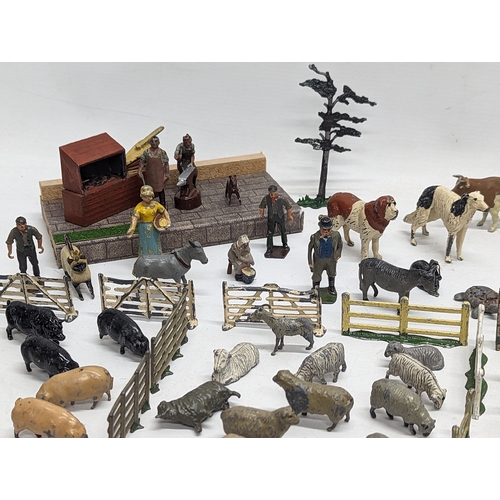 127 - A large collection of vintage Britains led animals, etc. Including Blacksmiths, Racehorses, farm yar... 