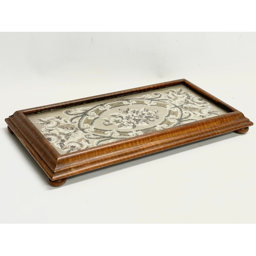 266 - A Victorian mahogany framed stand with beadwork and glass top. 50x26x6cm