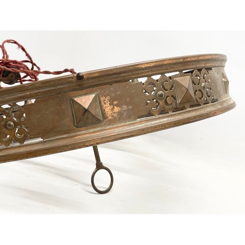 274 - An Edwardian copper ‘Rise and Fall’ ceiling light. 47cm wide.