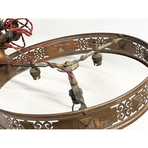 274 - An Edwardian copper ‘Rise and Fall’ ceiling light. 47cm wide.