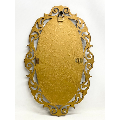 283 - A vintage ornate gilt framed bevelled mirror by Aisonea 48x76cm