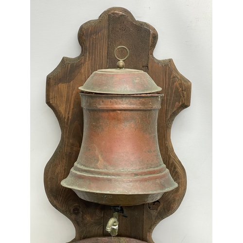 290 - A 19th century French wall mounted copper fountain. 96cm