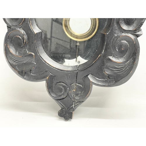 296 - A late 19th century oak wall clock with pendulum. 29x69cm