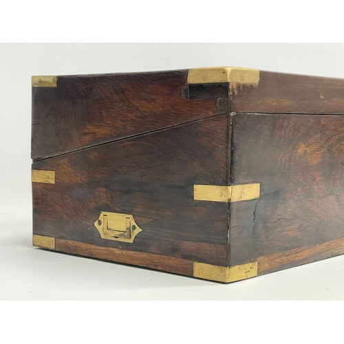 299 - A large Victorian rosewood brass bound writing slope with exterior side drawer. 51x26x17.5cm closed.