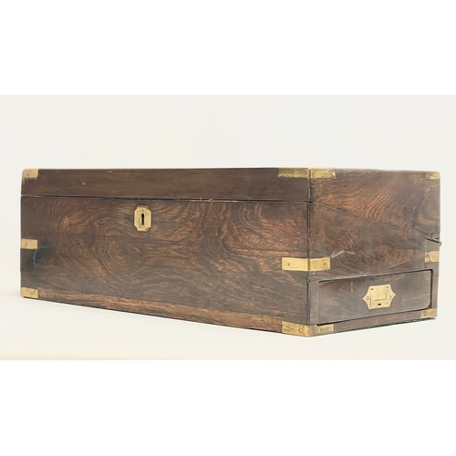 299 - A large Victorian rosewood brass bound writing slope with exterior side drawer. 51x26x17.5cm closed.