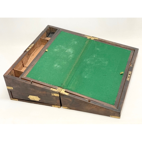 299 - A large Victorian rosewood brass bound writing slope with exterior side drawer. 51x26x17.5cm closed.