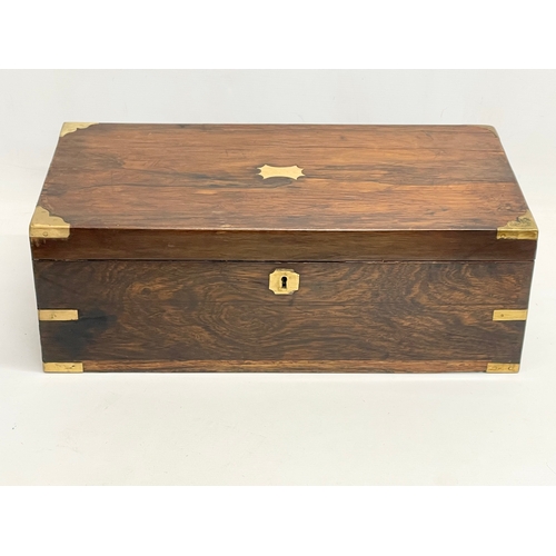 299 - A large Victorian rosewood brass bound writing slope with exterior side drawer. 51x26x17.5cm closed.