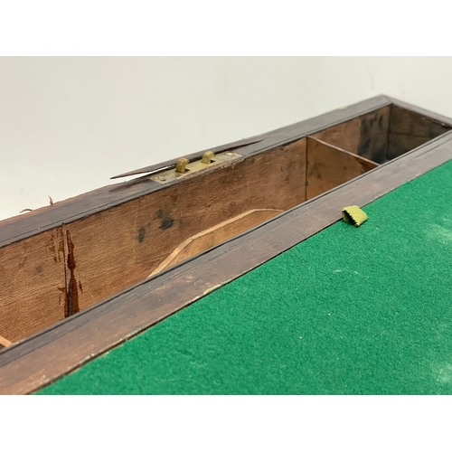 299 - A large Victorian rosewood brass bound writing slope with exterior side drawer. 51x26x17.5cm closed.