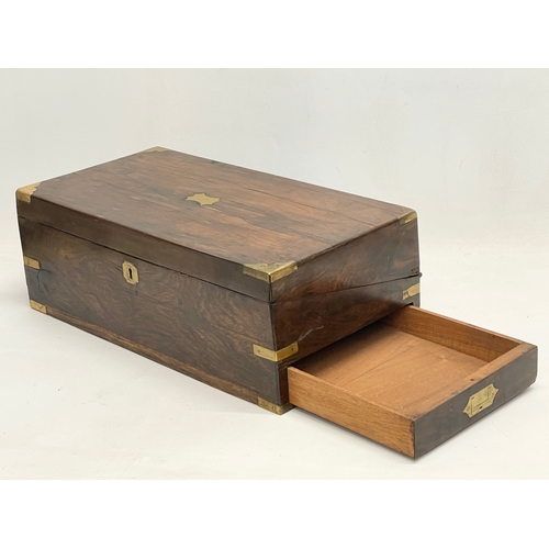 299 - A large Victorian rosewood brass bound writing slope with exterior side drawer. 51x26x17.5cm closed.