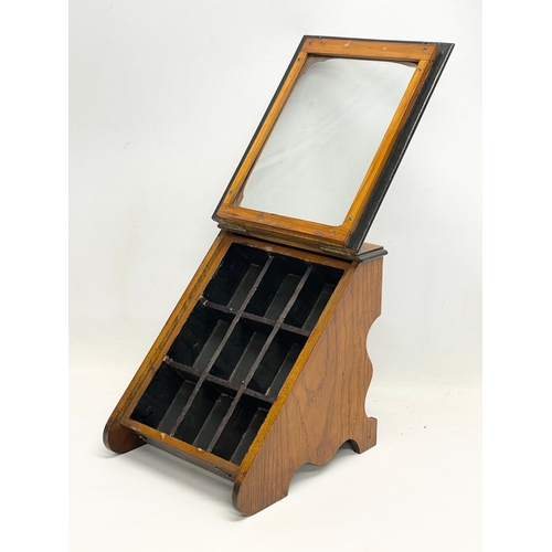 302 - An Edwardian oak table top display cabinet. 24x27x27.5cm