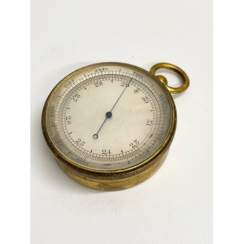 181 - A late Victorian brass pocket barometer in case.