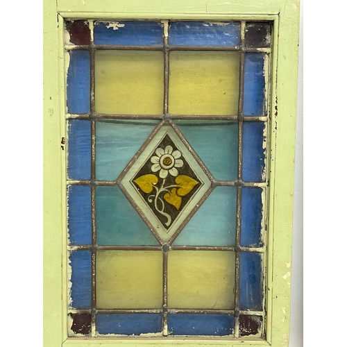 305 - A pair of early 20th century stain glass panels. 26.5x39.5cm