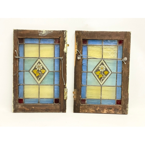 305 - A pair of early 20th century stain glass panels. 26.5x39.5cm