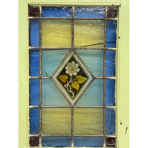 305 - A pair of early 20th century stain glass panels. 26.5x39.5cm