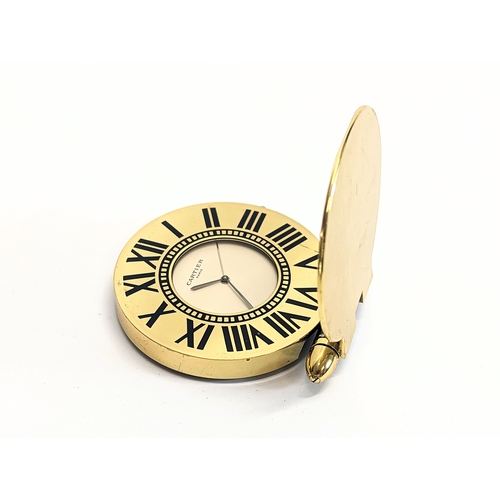 594 - A vintage travel clock, Cartier, Paris. 6cm