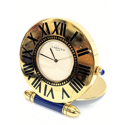 594 - A vintage travel clock, Cartier, Paris. 6cm