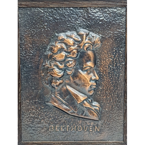 195P - An early 20th century framed oxidised copper plaque of Beethoven. 25.5x30.5cm including frame.